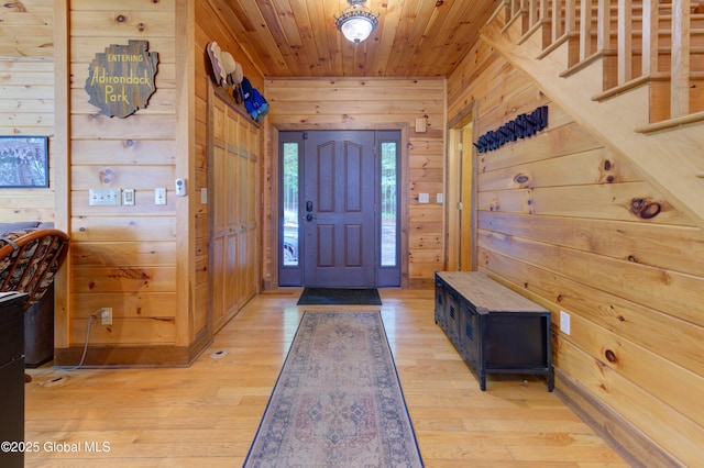 102 Taylor Ct, Mayfield, NY 12117 - entryway with wooden walls, wood ceiling, and light wood-type flooring