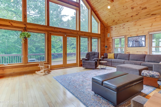 102 Taylor Ct, Mayfield, NY 12117 - living area with high vaulted ceiling, french doors, wooden walls, hardwood / wood-style flooring, and wood ceiling