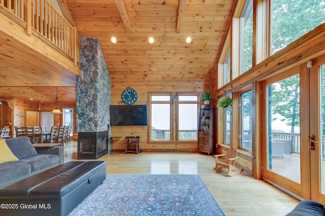 102 Taylor Ct, Mayfield, NY 12117 - living room featuring high vaulted ceiling, wood ceiling, healthy amount of natural light, wooden walls, and wood finished floors