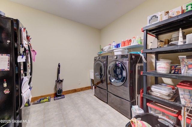 102 Taylor Ct, Mayfield, NY 12117 - washroom featuring washing machine and clothes dryer and tile patterned flooring