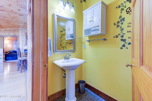 102 Taylor Ct, Mayfield, NY 12117 - bathroom featuring wood walls and wood finished floors