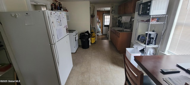 1 Alden St, Colonie, NY 12189 - kitchen with white appliances and brown cabinets