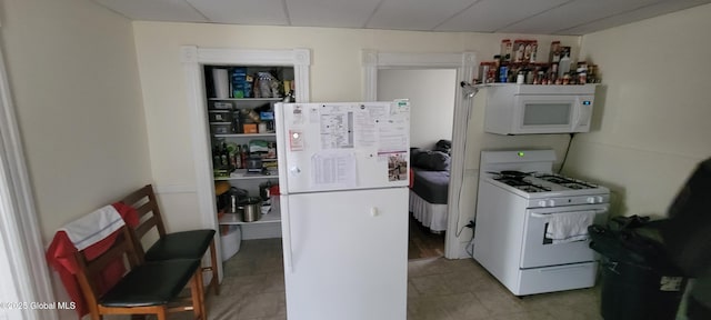1 Alden St, Colonie, NY 12189 - kitchen with white appliances and tile patterned flooring