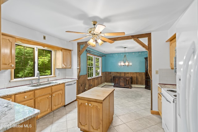 654 Birchwood Dr, Princetown, NY 12056 - kitchen with white appliances, wainscoting, a baseboard radiator, a kitchen island, and a chandelier