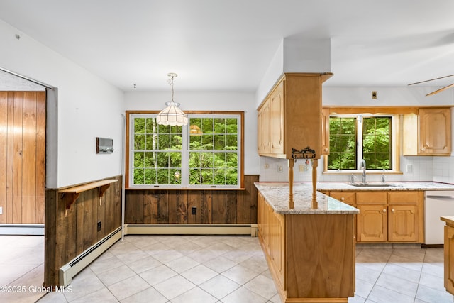 654 Birchwood Dr, Princetown, NY 12056 - kitchen featuring dishwasher, wainscoting, a peninsula, a baseboard heating unit, and light stone counters