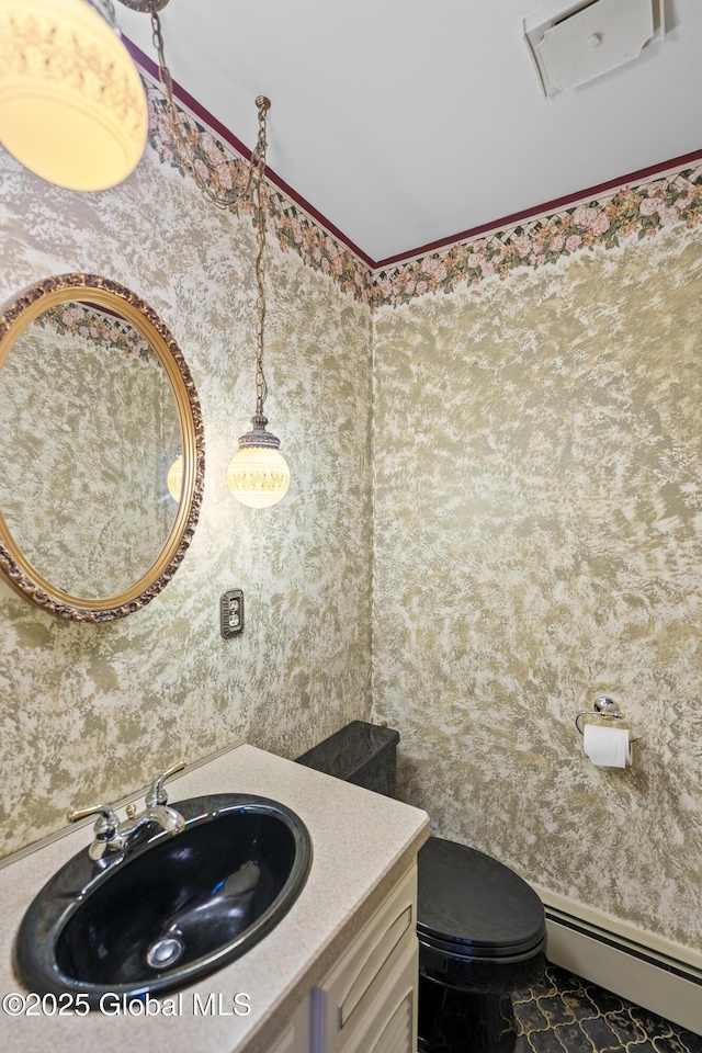 654 Birchwood Dr, Princetown, NY 12056 - half bathroom with a baseboard radiator, wallpapered walls, vanity, and marble finish floors