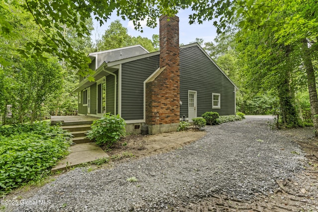 654 Birchwood Dr, Princetown, NY 12056 - view of property exterior featuring a chimney and gravel driveway