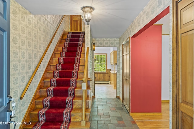 654 Birchwood Dr, Princetown, NY 12056 - stairway featuring wallpapered walls and baseboard heating