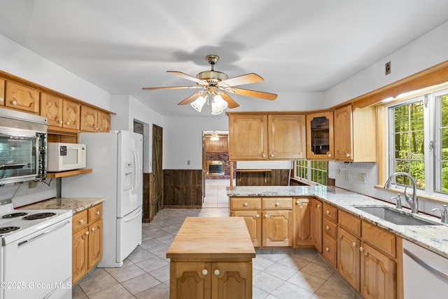 654 Birchwood Dr, Princetown, NY 12056 - kitchen featuring white appliances, a ceiling fan, wainscoting, wooden counters, and glass insert cabinets