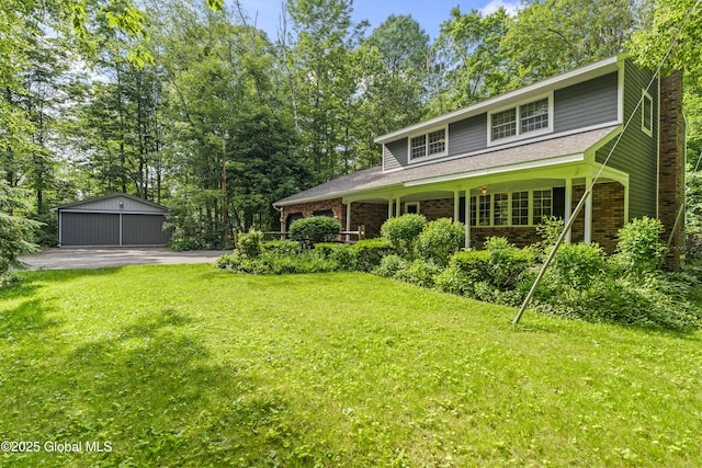 654 Birchwood Dr, Princetown, NY 12056 - view of green lawn featuring an outbuilding and a garage