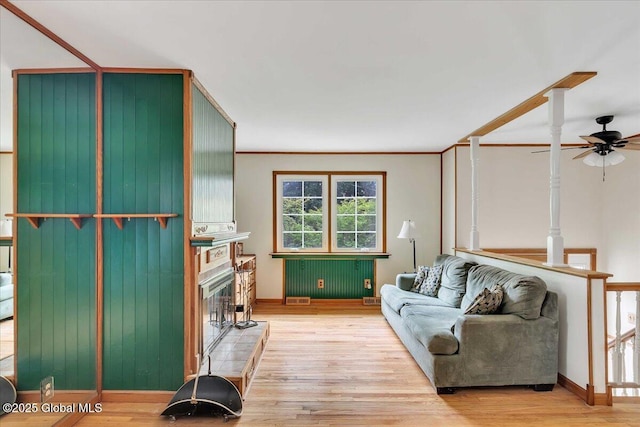 273 Pinehurst Ave, East Greenbush, NY 12144 - living area featuring a glass covered fireplace, a ceiling fan, and light wood finished floors