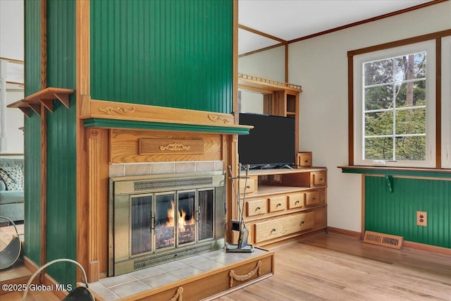 273 Pinehurst Ave, East Greenbush, NY 12144 - detailed view of wood finished floors, a fireplace, and crown molding