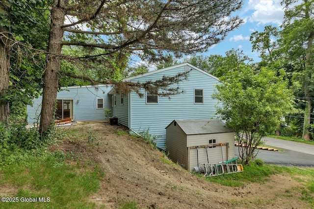 273 Pinehurst Ave, East Greenbush, NY 12144 - view of side of home with a garage and a central AC unit