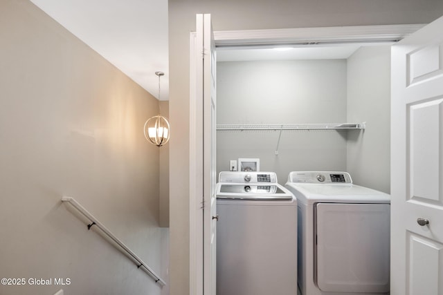 5 Heather Ln, Corinth, NY 12822 - laundry area featuring washer and dryer and a chandelier