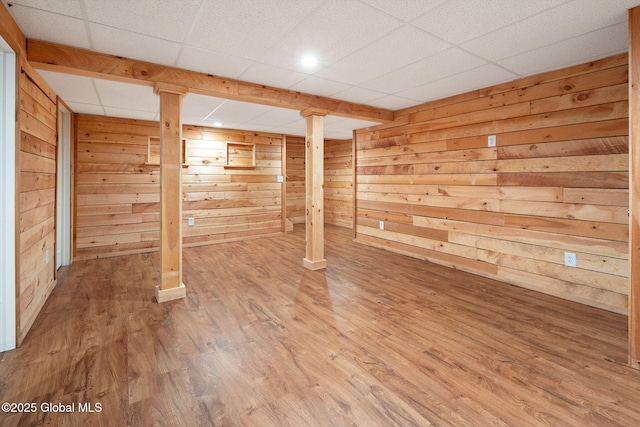 5 Heather Ln, Corinth, NY 12822 - finished below grade area with wood finished floors, a drop ceiling, and wood walls