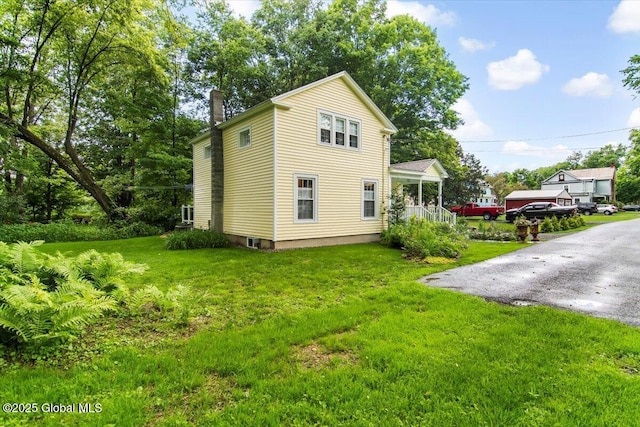 4 Mitchell Ave, Cambridge, NY 12816 - view of side of property featuring a chimney and a lawn