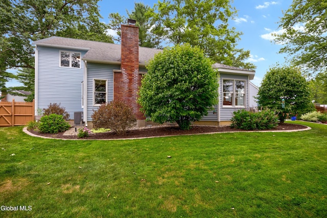 658 Salvia Ln, Guilderland, NY 12303 - back of property with a chimney and roof with shingles