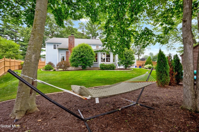 658 Salvia Ln, Guilderland, NY 12303 - rear view of property with a chimney