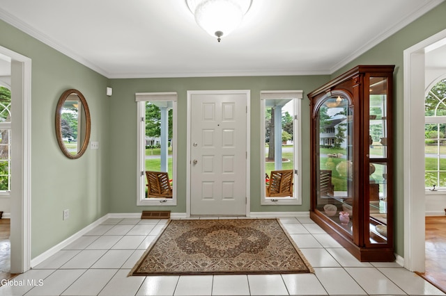 658 Salvia Ln, Guilderland, NY 12303 - foyer featuring light tile patterned floors and crown molding
