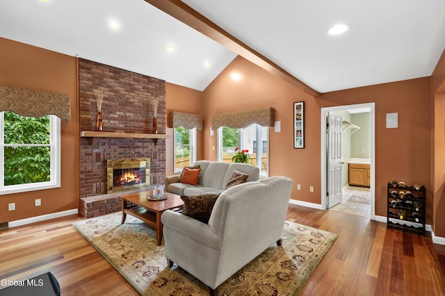658 Salvia Ln, Guilderland, NY 12303 - living area featuring wood finished floors, a fireplace, lofted ceiling, and recessed lighting
