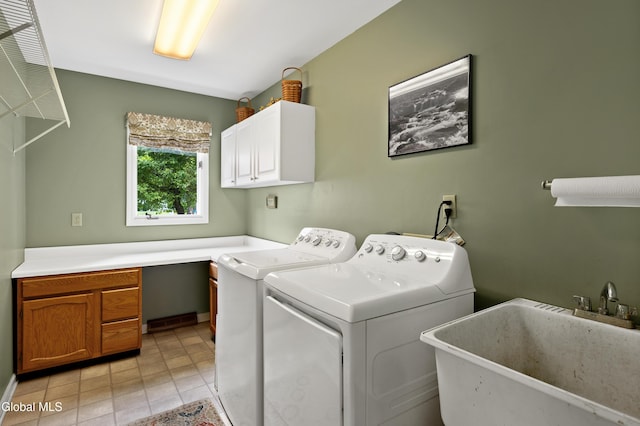 658 Salvia Ln, Guilderland, NY 12303 - laundry room with cabinet space, washing machine and clothes dryer, and light tile patterned flooring