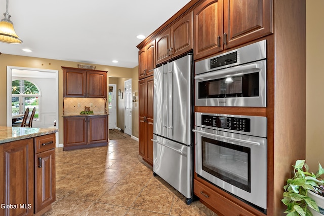 658 Salvia Ln, Guilderland, NY 12303 - kitchen featuring stainless steel appliances, tasteful backsplash, light tile patterned floors, recessed lighting, and hanging light fixtures