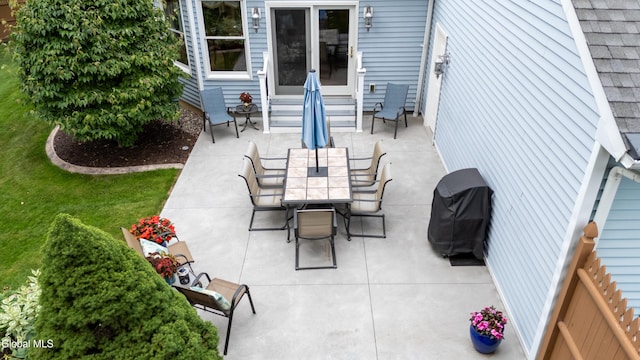 658 Salvia Ln, Guilderland, NY 12303 - view of patio featuring entry steps, area for grilling, and outdoor dining space