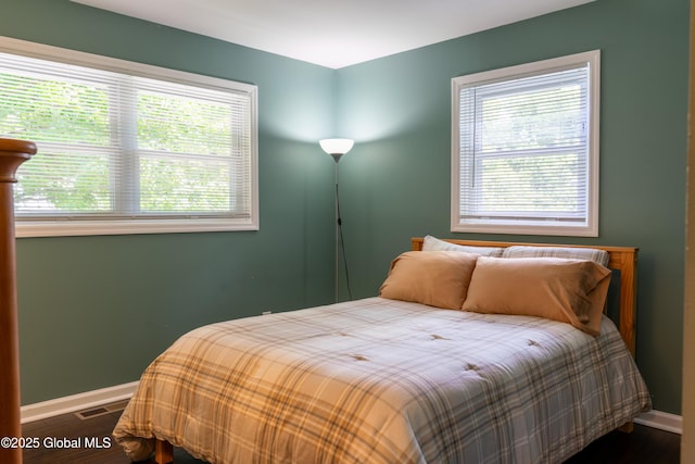 12 Heritage Ln, Clifton Park, NY 12065 - bedroom featuring multiple windows and wood finished floors