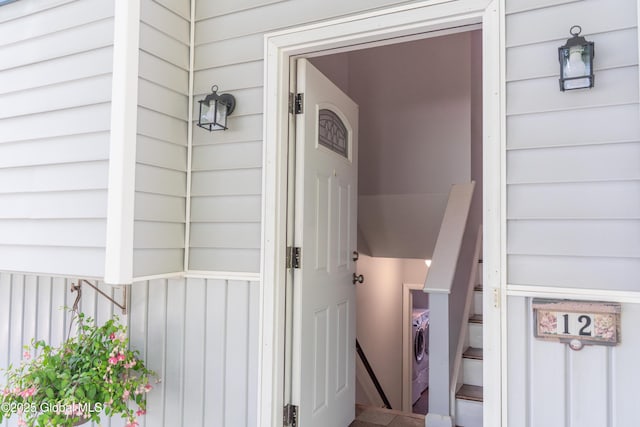 12 Heritage Ln, Clifton Park, NY 12065 - view of exterior entry featuring separate washer and dryer and board and batten siding