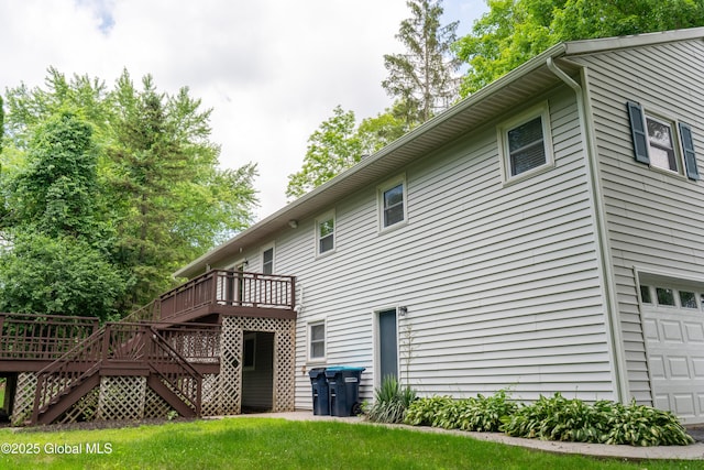 12 Heritage Ln, Clifton Park, NY 12065 - rear view of house featuring a wooden deck, a garage, and stairs