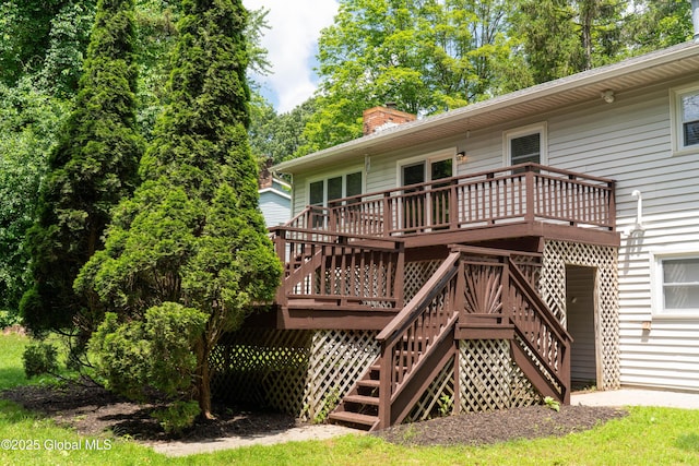 12 Heritage Ln, Clifton Park, NY 12065 - back of property with a deck, stairway, and a chimney