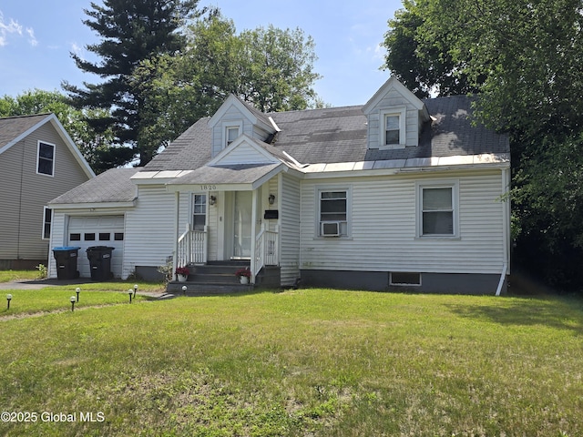 1820 Wagner St, Rotterdam, NY 12303 - cape cod-style house featuring an attached garage, a front yard, cooling unit, and roof with shingles
