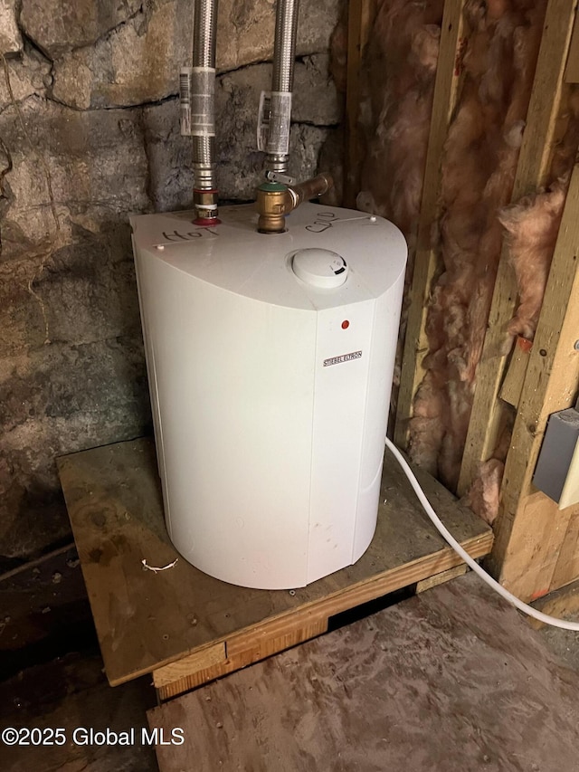 59 W St, Whitehall Village, NY 12887 - utility room with water heater