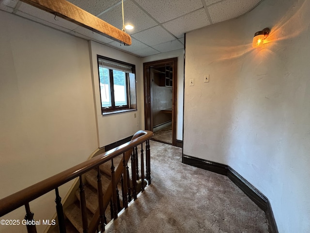 59 W St, Whitehall Village, NY 12887 - corridor featuring an upstairs landing, carpet floors, a baseboard heating unit, and a drop ceiling