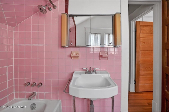 1280 Dean St, Niskayuna, NY 12309 - full bathroom featuring tile walls, wood finished floors, and bathing tub / shower combination