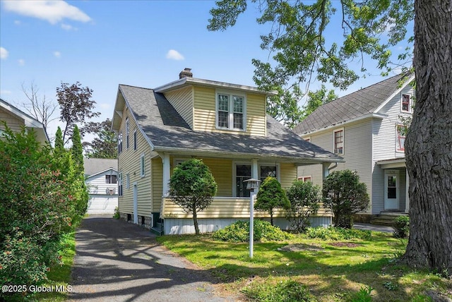 1280 Dean St, Niskayuna, NY 12309 - view of front of home featuring a chimney, a detached garage, and a porch
