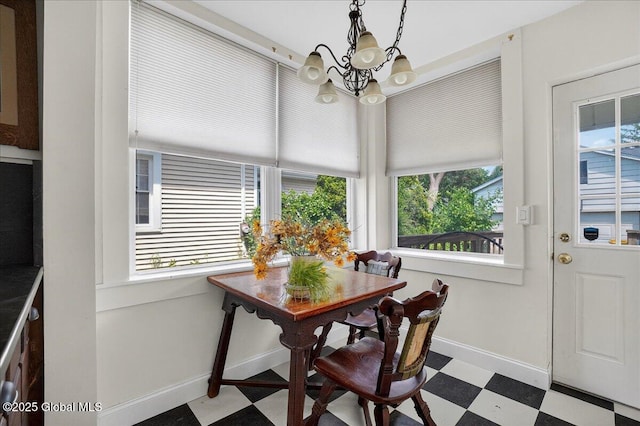 1280 Dean St, Niskayuna, NY 12309 - dining area featuring tile patterned floors, a chandelier, and plenty of natural light