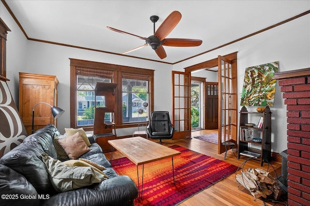 1280 Dean St, Niskayuna, NY 12309 - living area with wood finished floors, ornamental molding, and ceiling fan