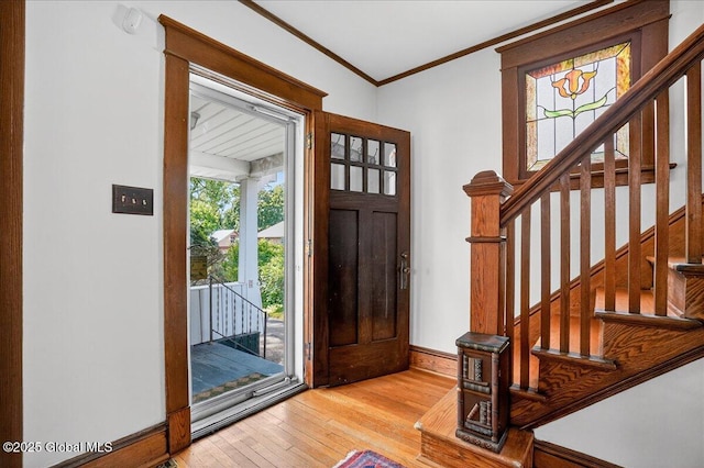 1280 Dean St, Niskayuna, NY 12309 - foyer entrance featuring hardwood / wood-style flooring, crown molding, and stairway