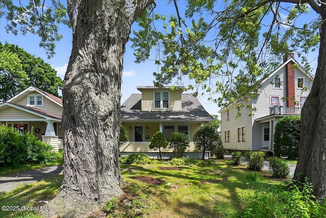 1280 Dean St, Niskayuna, NY 12309 - view of front facade with a front yard and a shingled roof