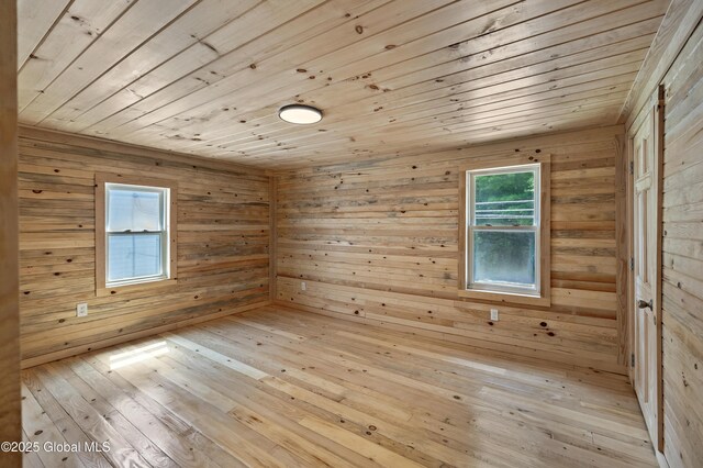 28 Gates Ave, Victory, NY 12871 - unfurnished room featuring a relaxing sauna, wooden ceiling, wooden walls, and light wood finished floors