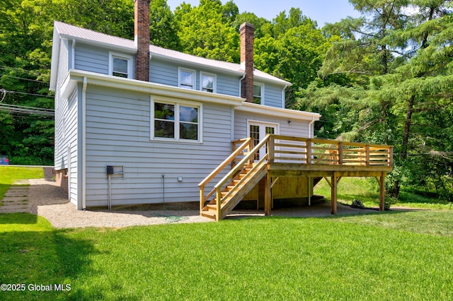 28 Gates Ave, Victory, NY 12871 - back of house with a wooden deck, stairway, a chimney, a yard, and a metal roof