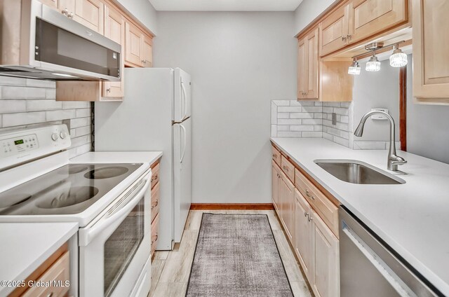 183 Cedarview Ln, Colonie, NY 12189 - kitchen featuring appliances with stainless steel finishes, light brown cabinets, and backsplash