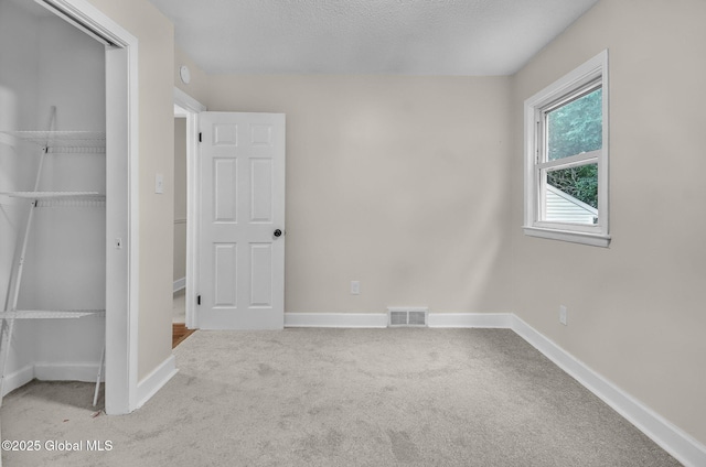 311 Old Loudon Rd, Colonie, NY 12110 - unfurnished bedroom featuring carpet floors and a closet