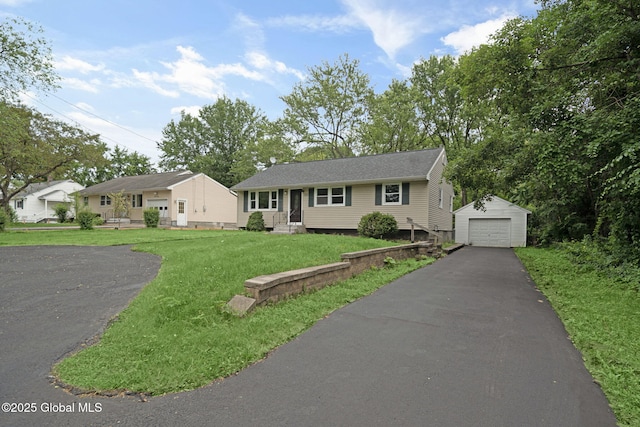 311 Old Loudon Rd, Colonie, NY 12110 - ranch-style home featuring an outdoor structure, a garage, driveway, and a front lawn