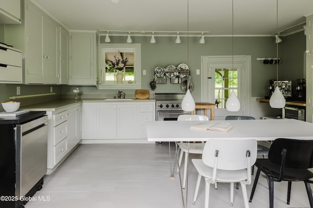 88 Mac Brown Rd, Claverack, NY 12513 - kitchen featuring stainless steel appliances, a kitchen breakfast bar, track lighting, light countertops, and ornamental molding