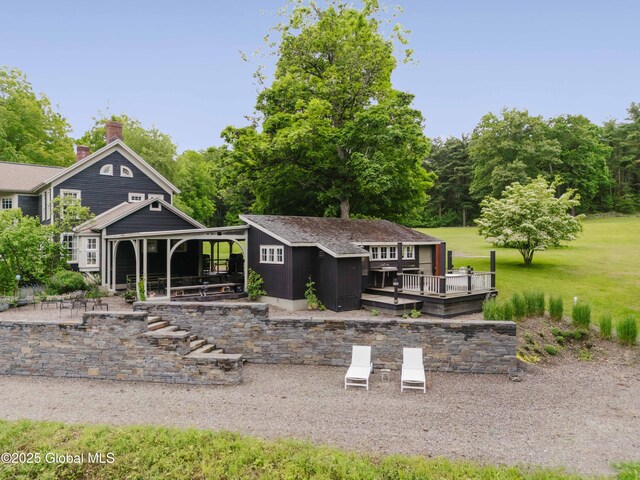 88 Mac Brown Rd, Claverack, NY 12513 - back of property with a deck, a storage shed, and a chimney