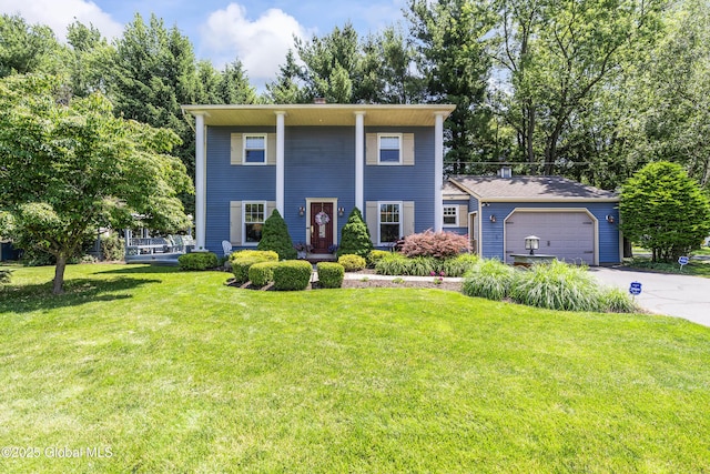 2 Eddy Ln, East Greenbush, NY 12144 - greek revival house with driveway, a front yard, and a garage