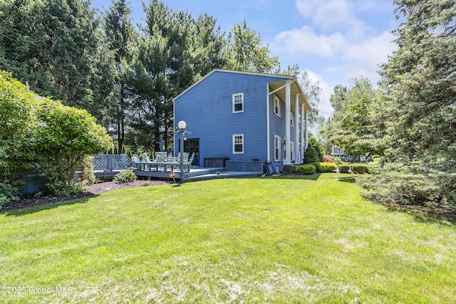 2 Eddy Ln, East Greenbush, NY 12144 - rear view of house featuring a wooden deck and a lawn
