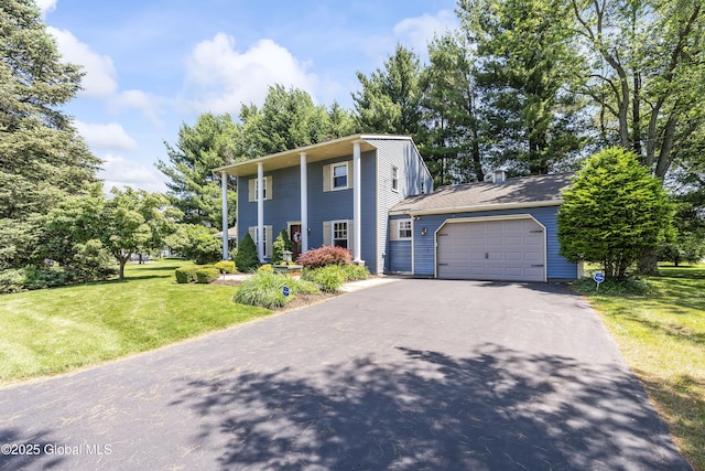 2 Eddy Ln, East Greenbush, NY 12144 - neoclassical home with an attached garage, driveway, and a front lawn